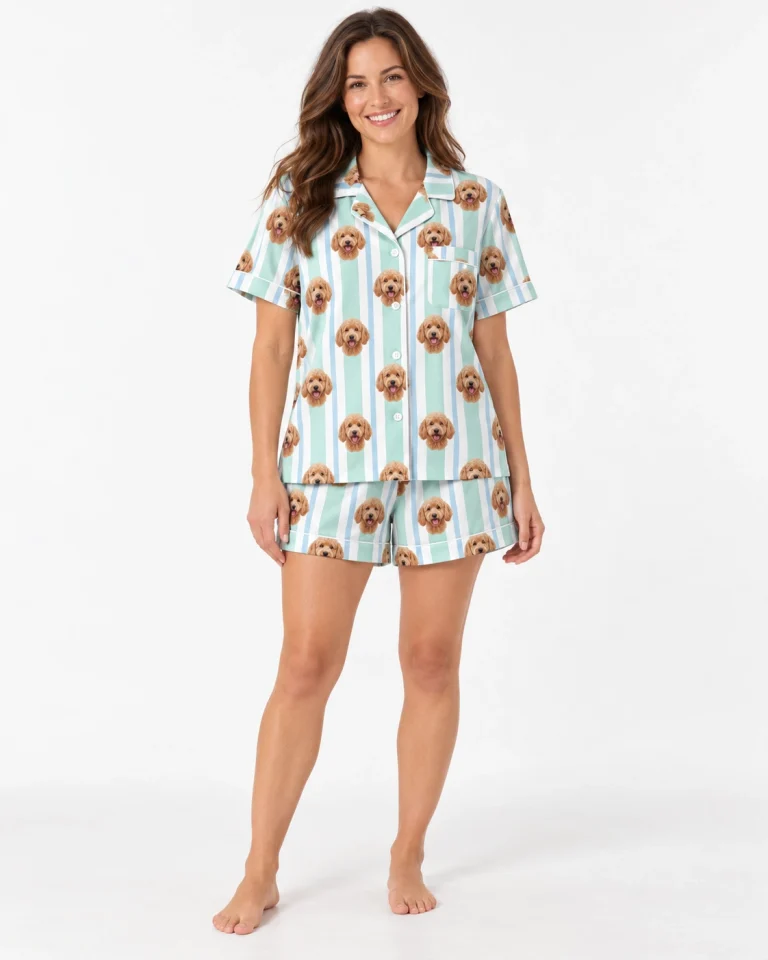 Woman wearing goldendoodle pajamas printed with apricot doodle faces on mint and white striped satin — MyDogPics